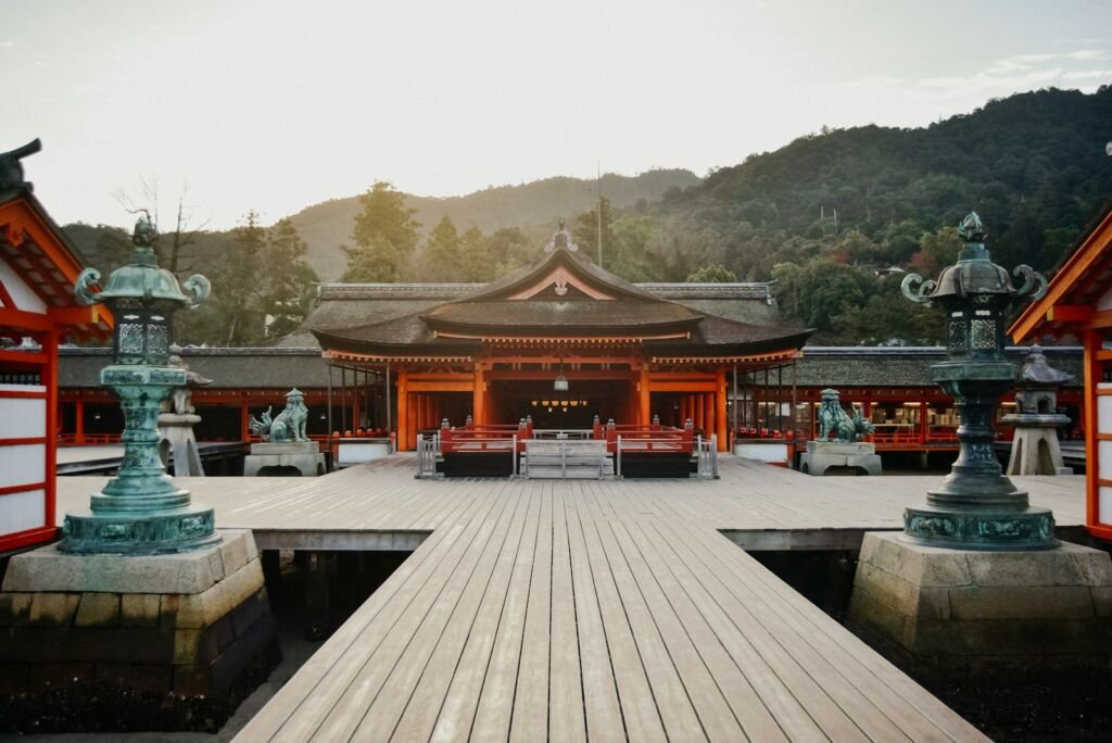 brown wooden gazebo near green trees during daytime